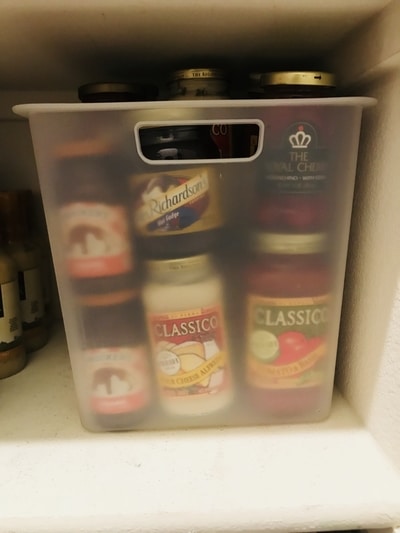 glass jars in a pantry bin so they don't break during an earthquake.