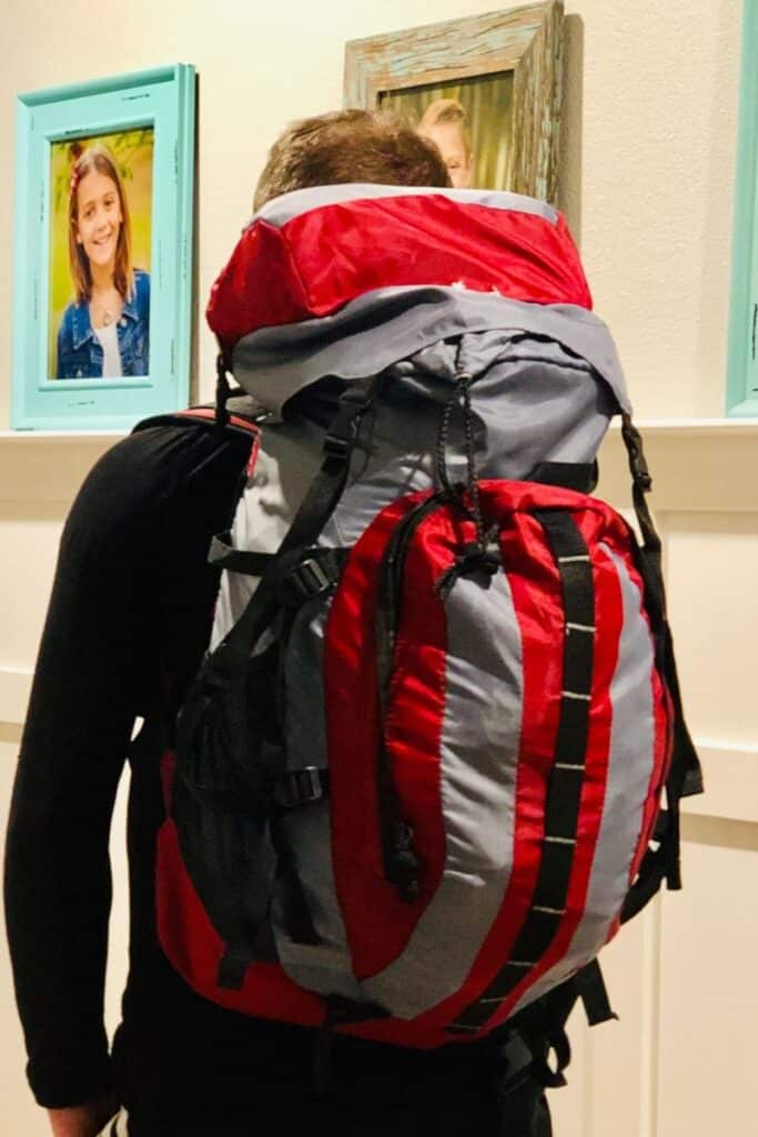 teenage kid wearing 72-hour kit backpack