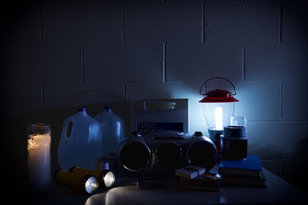 power outage essentials on a kitchen counter in the dark.