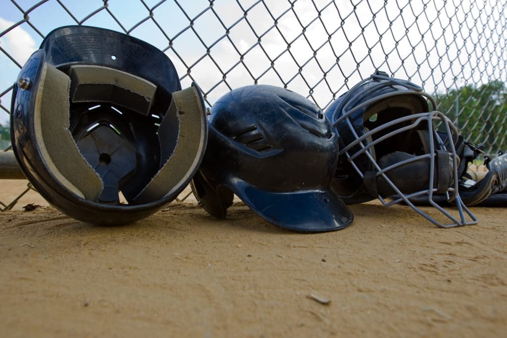 Helmets at a Little League Field #littleleaguemom #baseballmomtips #baseballmom