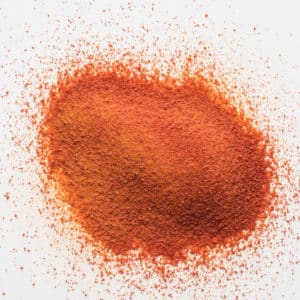 Thrive Life tomato powder in a pile on white background