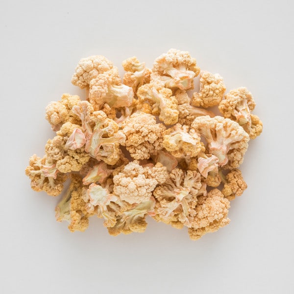 freeze dried cauliflower piled up on a white countertop
