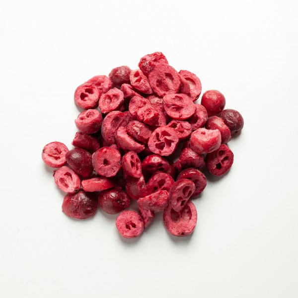 freeze dried sweetened cranberries piled on a white table