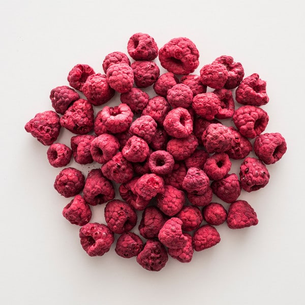 pile of freeze dried raspberries on a white countertop