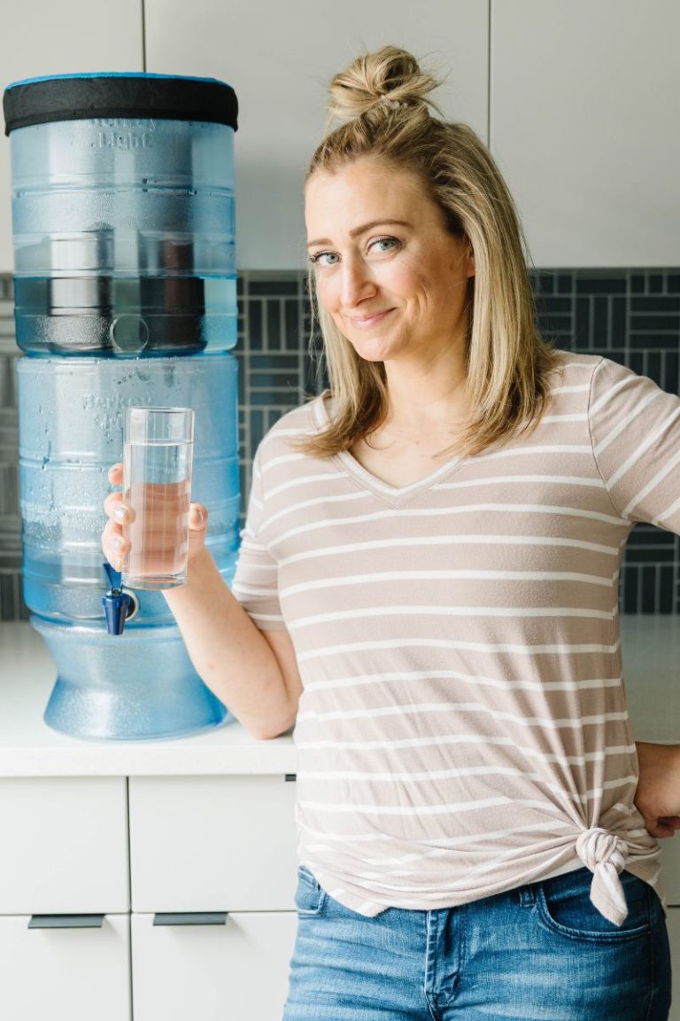 melanie papworth smiling holding a glass of water from Berkey Light