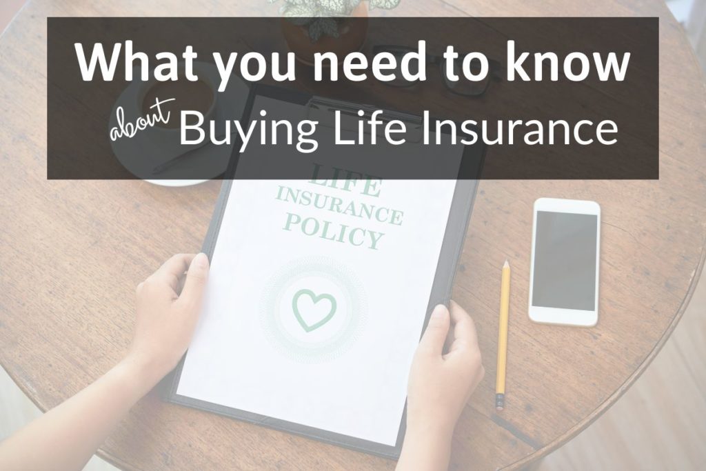 hands holding clipboard with paper about life insurance