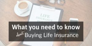 hands holding a clipboard with life insurance policy attached