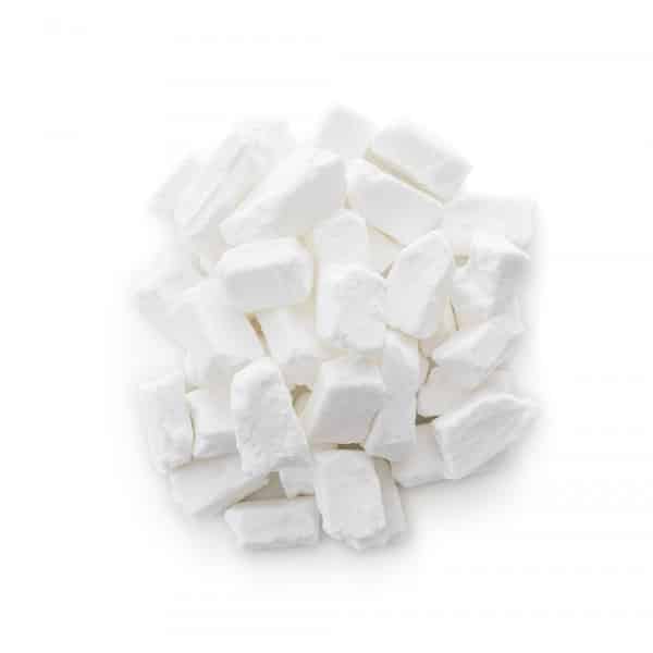 pile of freeze dried coconut bites on white countertop