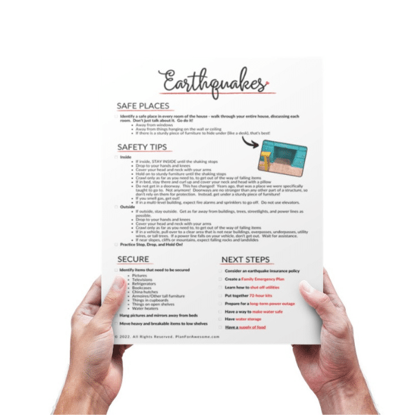 Two hands holding the free earthquake printable