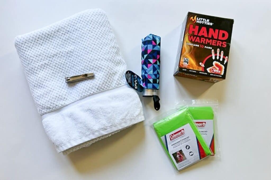homemade emergency car kit items like a towel handwarmers poncho.