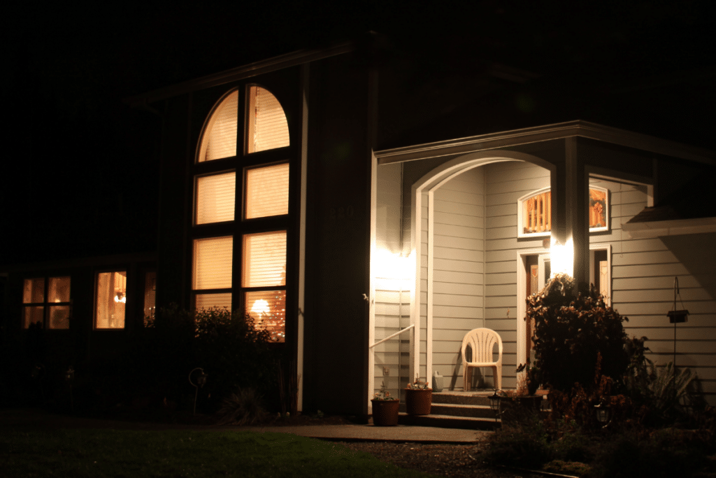 A porch with lights on.